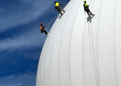 Radome climbers performing detailed inspection of a large air supported radome.