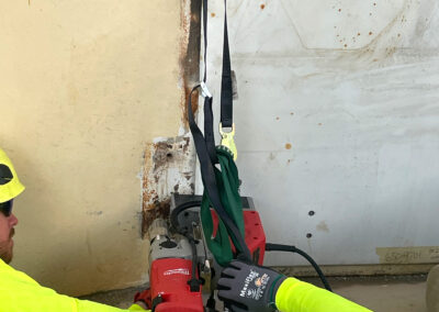 Radome and airlock maintenance being performed by two technicians.
