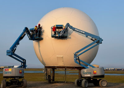 Sealing a Sheergard rigid sandwich radome using Genie MEWPs.
